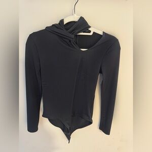 Black long sleeve zip up bodysuit from Zara with tie detail and cutout